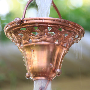Copper Florence Cup Rain Chain with water flowing through cup