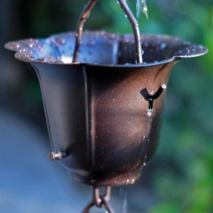 Bronze Flower Cups Rain Chain with water flowing through cup