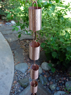 Copper Kenchiku Rain Chain on home without water running through cups