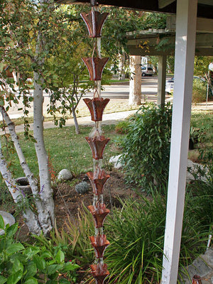 Large Square Cups Aged Copper Rain Chain on house with water flowing through multiple cups