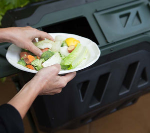 adding food waste to Mr.Spin® Compost Tumbler