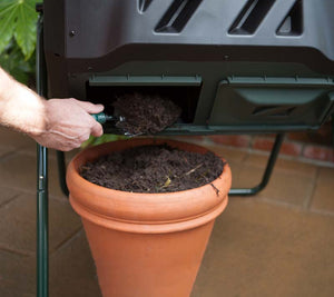 harvesting compost from Mr.Spin® Compost Tumbler