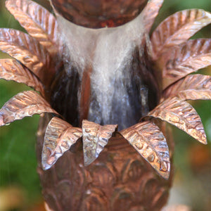 Closeup of Pineapple Theme Copper Rain Chain with water flowing