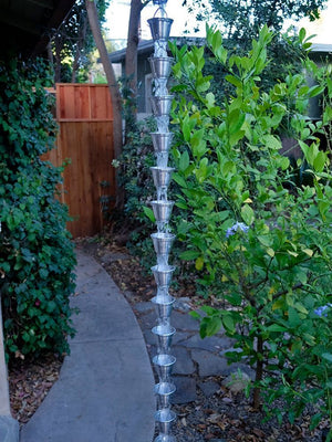 Full length view of Shizuka Cups Rain Chain in aluminum