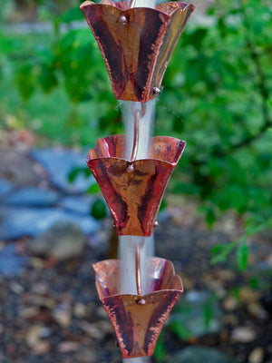 Small Square Aged Copper Cups Rain Chain with water flowing through multiple cups