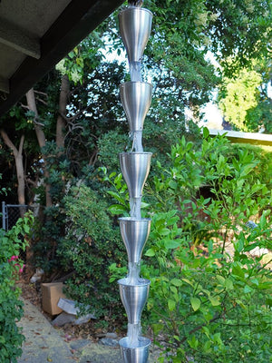Aluminum Smooth Cups Rain Chain on house with water flowing through multiple cups