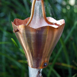 Star Flower Cups Rain Chain in platted copper with water flowing through cup