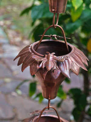 close of of beautiful honeybee on the Sunflower Copper Rain Chain